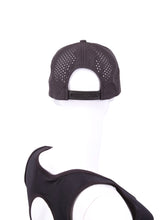 Load image into Gallery viewer, The Black Hat LLT Logo Holey Back with the "Love Love Tennis" Logo and holey back is a stylish and functional accessory designed for tennis enthusiasts who want to combine fashion with functionality on the court. The hat is primarily black, which gives it a sleek and versatile appearance, making it suitable for various tennis outfits. At the front of the hat, prominently displayed, is the "Love Love Tennis" logo.