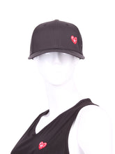 Load image into Gallery viewer, Black Hat + Red Heart & Holey Back with the "Love Love Tennis" Heart and holey back is a stylish and functional accessory designed for tennis enthusiasts who want to combine fashion with functionality on the court. The hat is primarily black, which gives it a sleek and versatile appearance, making it suitable for various tennis outfits. At the front of the hat, prominently displayed, is the "Love Love Tennis" Heart logo.
