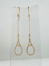 Load image into Gallery viewer, Custom exclusive design by Adeline a very unique pair of earrings. The rackets are 1" long and the earrings sit 2 1/2" down. The racket and hook are solid gold and adorned with many beautiful clear diamonds to make you "shine" on the court. Very strong yet light enough to play in!