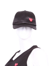 Load image into Gallery viewer, The Soft Satin Black Tennis Hat is a stylish and functional accessory designed for tennis enthusiasts. Crafted from a smooth satin material, this hat offers a comfortable and lightweight feel. Its sleek black color adds a touch of sophistication to your tennis attire, while the soft texture ensures a pleasant wearing experience.