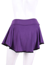 Load image into Gallery viewer, This limited Purple LOVE "O" Skirt has shorties underneath and NO seams on the "O"!  It's cut like a doughnut to show and move beautifully as you play.  The fabric is uber soft and light - it dries quickly - and protects from UV rays too.  This skirt has a “nearly naked” feel about it.  The embroidery Heart is Black + Rackets and Ball Purple to match the skirt.  Sleek black thread and binding.