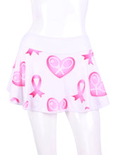 Load image into Gallery viewer, This gorgeous Pink Breast Cancer Awareness and Rackets on white LOVE "O" Skirt has shorties underneath and NO seams on the "O"! It's cut like a doughnut to show and move beautifully as you play. The fabric is uber soft and light - it dries quickly - and protects from UV rays too. This skirt has a “nearly naked” feel about it.