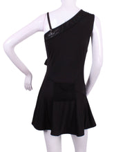 Load image into Gallery viewer, The Charmaine Court To Cocktails Tennis Dress in Black. Flirty and alluring. That's the Charmaine tennis dress. Wear this sexy dress from the court to cocktails. The off the shoulder neck, asymmetrical lines, and side slit make this our most sexy dress. It is a fitted cut, but lined to give support, and is sewn with our silky soft stretchy fabric. This dress is short, it sits high on the thigh. This dress comes with its own one-sided matching soft bra to wear underneath.