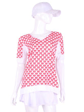 Load image into Gallery viewer, The very comfortable Baggy Vee Tee is so cool and easy to wear. For the lady that likes a little room when she plays - the feminine top is flowing in the air. This Mini Hearts on a white background has a white stripe down the sides, hem, collar, and cuff.