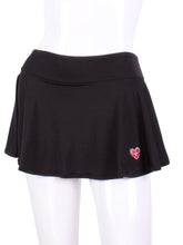 Load image into Gallery viewer, This limited Black LOVE "O" Skirt has shorties underneath and NO seams on the "O"!  It's cut like a doughnut to show and move beautifully as you play.  The fabric is uber soft and light - it dries quickly - and protects from UV rays too.  This skirt has a “nearly naked” feel about it.  The embroidery Heart is Red + Rackets and Ball Black to match the mesh.  Sleek black thread on the binding.