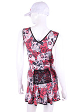 Load image into Gallery viewer, The Angelina Dress is modern yet classy. This style is in our very limited Skull + Roses print, with a flattering vee style neck neckline. This soft, silky, and sexy tennis dress has an empire waist and a feminine skirt. With the exclusive dry ball back pocket - you don't need to tuck your tennis balls into your shorts anymore. Designed by our Founder Adeline in Beverly Hills. Sewn by our team in Downtown Los Angeles.