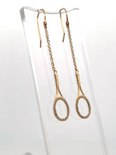 Load image into Gallery viewer, Custom exclusive design by Adeline a very unique pair of earrings.   The rackets are 1&quot; long and the earrings sit 2 1/2&quot; down.  The racket and hook are solid gold and adorned with many beautiful clear diamonds to make you &quot;shine&quot; on the court.  Very strong yet light enough to play in!
