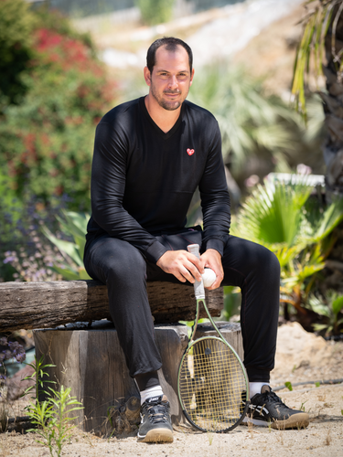 The Limited French Terry Long Sleeve Black Tennis Shirt by Love Love Tennis is a premium sportswear piece that seamlessly combines style, comfort, and performance.