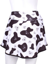 Load image into Gallery viewer,    This is our limited edition Gladiator Skirt CowPrint.  This piece has a silky soft and quick-drying matching shorties, and binding to match.  We make these in very small quantities - by design.  Unique.  Luxurious.  Comfortable.  Cool.  Fun.
