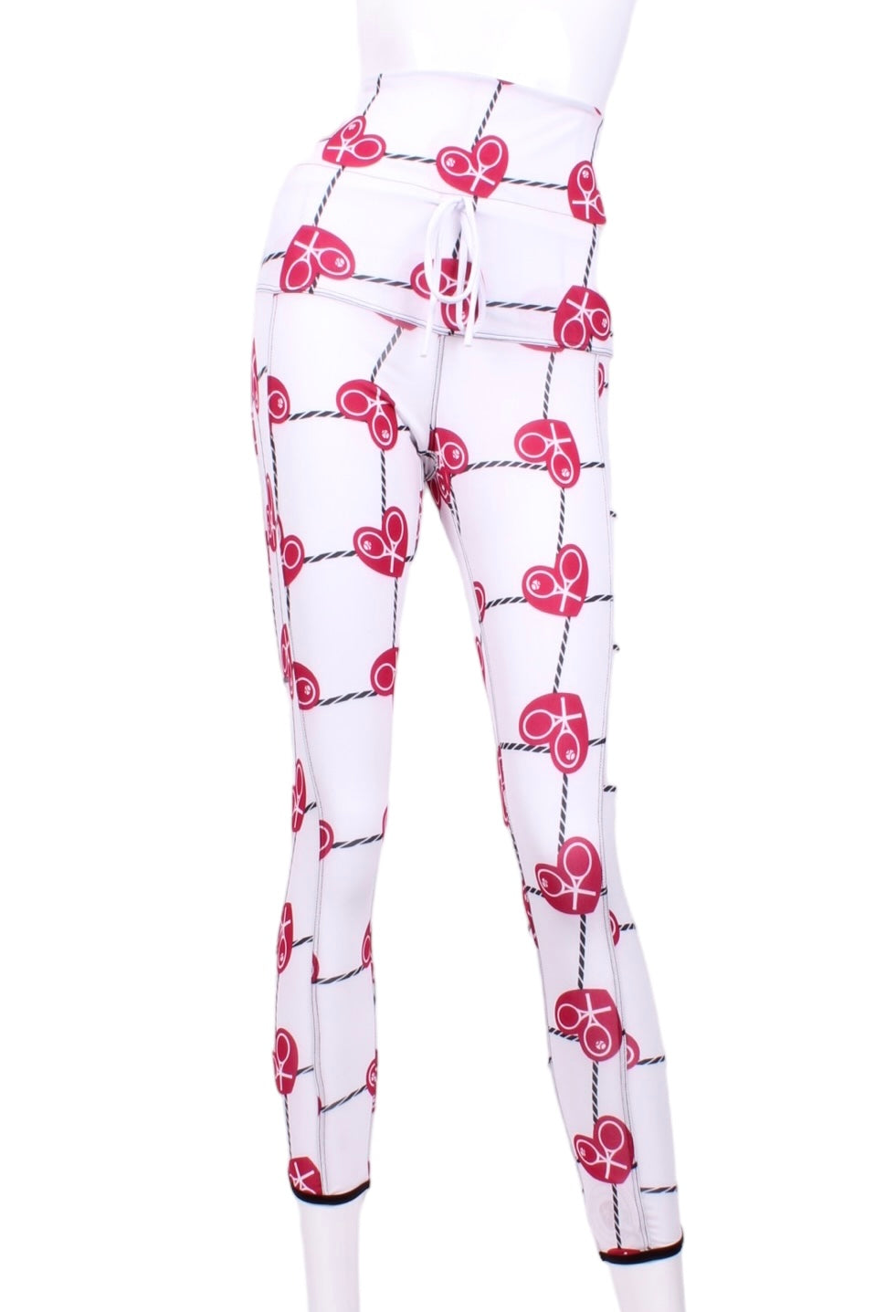 This is our limited edition roll down waist leggings in Raspberry Red Hearts & Net.  This piece has a silky soft and quick-drying with a convenient back pocket for your tennis balls.  We make these in very small quantities - by design.  Unique.  Luxurious.  Comfortable.  Cool.  Fun.