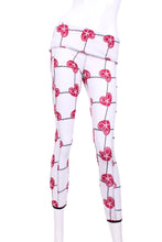 Load image into Gallery viewer, This is our limited edition roll down waist leggings in Raspberry Red Hearts &amp; Net.  This piece has a silky soft and quick-drying with a convenient back pocket for your tennis balls.  We make these in very small quantities - by design.  Unique.  Luxurious.  Comfortable.  Cool.  Fun.
