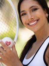 Load image into Gallery viewer, The cutest tennis balls ever.   The pressured white balls are handmade in Bath, England (where Adeline the designer was actually born) - and bear the LOVE LOVE TENNIS trademark Heart + Rackets Logo.
