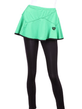 Load image into Gallery viewer, This is our limited edition Triangle Green Skirt with Black Leggings.  This piece has a silky soft and quick-drying and binding to match.  We make these in very small quantities - by design.  Unique.  Luxurious.  Comfortable.  Cool.  Fun.
