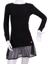 Load image into Gallery viewer, Long Sleeve Monroe Black Mesh Tennis Dress. The Monroe Dress offers a little more coverage around the chest and the arms, but delicately shows your feminine curves. Our dress is fitted, and flares out at the skirt. It is perfect for tennis, running and golf, and of course, a trip to your after-court party with your friends. It was designed for confident women like you! This style is in black with mesh, with a flattering bateau neckline.
