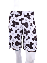Load image into Gallery viewer, This is our limited edition Short Men’s Shorts in Cow Print.  This piece has a silky and soft fabric.   We make these in very small quantities - by design.  Unique.  Luxurious.  Comfortable.  Cool.  Fun.
