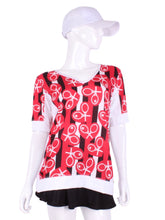 Load image into Gallery viewer, Red Hearts + Stripes Baggy Vee Tee The very comfortable Baggy Vee Tee is so cool and easy to wear.  For the lady that likes a little room when she plays - the feminine top is flowing in the air.  This Red Hearts + Stripes on white background has a white stripe down the sides, hem, collar and cuff.
