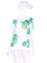 Load image into Gallery viewer,  Palm Trees + Court Baggy Vee Tee. The very comfortable Baggy Vee Tee is so cool and easy to wear.  For the lady that likes a little room when she plays - the feminine top is flowing in the air.  This Palm Trees + Tennis Court on a white background has a white stripe down the sides, hem, collar, and cuff.
